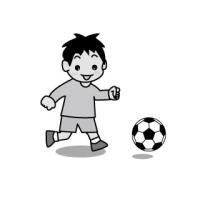 サッカーをする少年