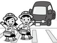 手をあげて横断歩道を渡る園児